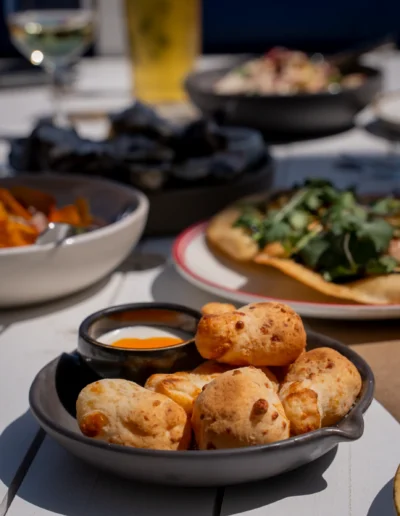 Chipas / 18 baked mozzarella & arrowroot cheese bread, whipped goats curd