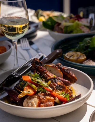Pollo a la Parilla / 38 half grilled chicken, confit garlic, lemon & chilli dressing, charred carrot & spring onion
